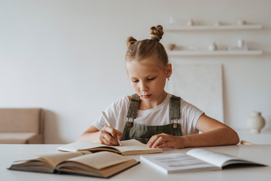 Young girl with braided hair concentrating on her homework at a desk with books, highlighting learning at home