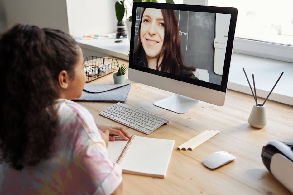 A teenage girl participates in a virtual class