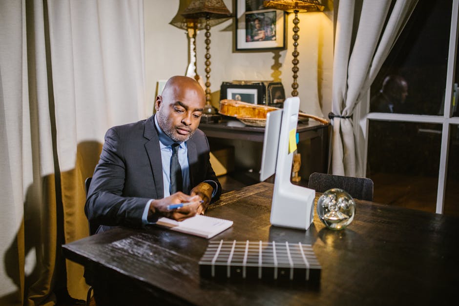 Professional businessman taking notes in a home office environment